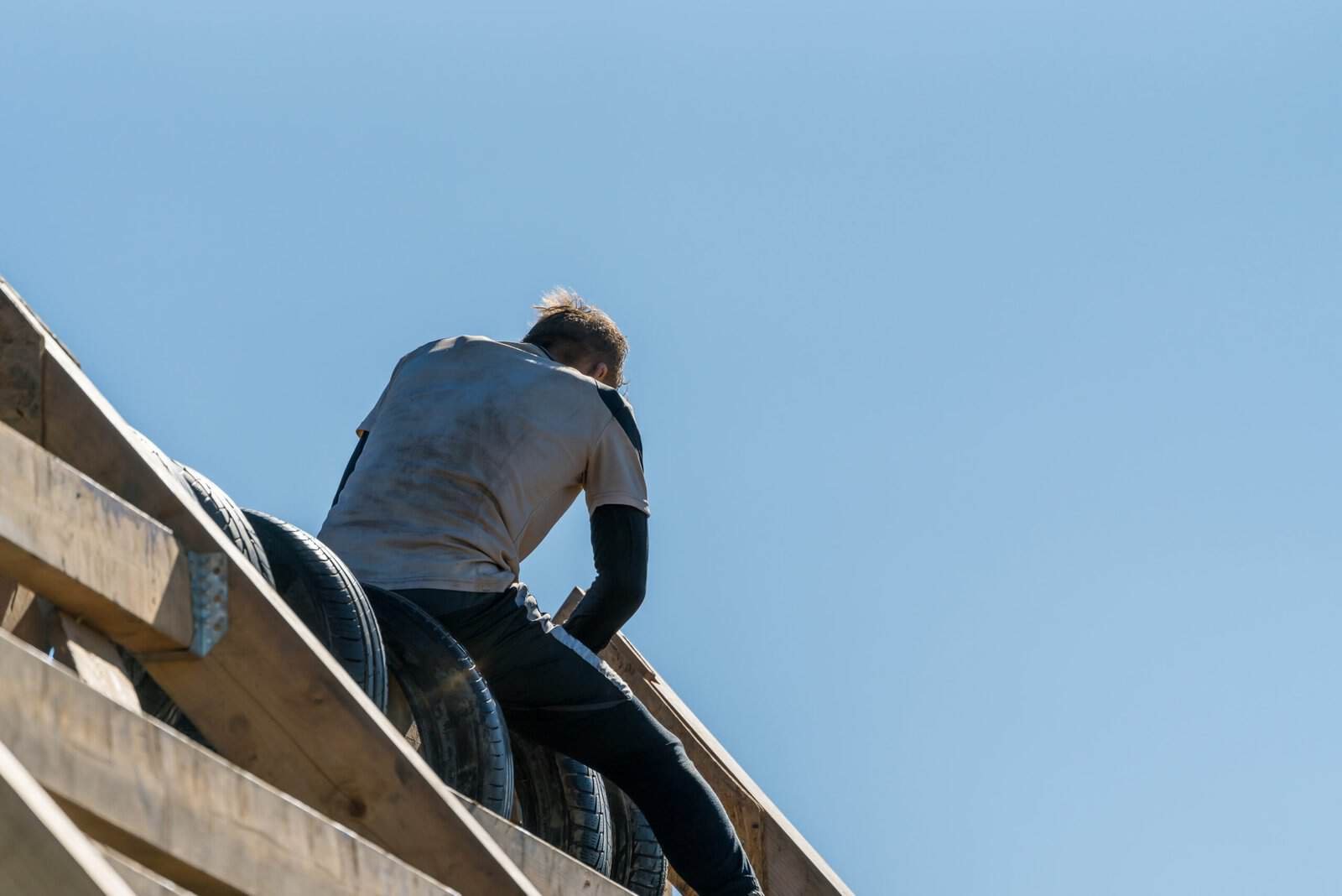 Roofing contractor installing shingles on a roof in Redlands, CA.